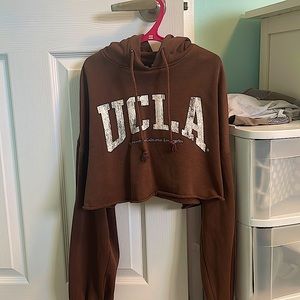 A brown UCLA H&M cropped hoodie. Great condition. Size XS